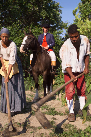 Colonial Williamsburg actor-interpreters performing a scene