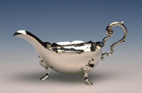 This elegant copy of a mid 18th-century sauceboat was crafted at the Golden Ball in Colonial Williamsburg using 18th-century silversmithing techniques.
