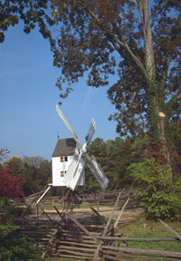 The windmill sits idle in this autumn view, but the miller worked when the wind was blowing – often at night or during a storm.