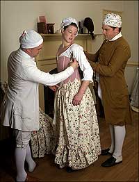 Tailor
Mark Hutter, left, and apprentice Neal Hurst, right, measure interpreter
Christina Diffel for stays
