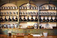 In drawers and in bottles and jars lining the shelves of the apothecary shop are liniments, potions, and pills.