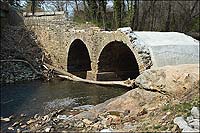 Stones from a seventeenth-century furnace make up this now-crumbling bridge.