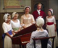 The Geddy family sings around the spinet