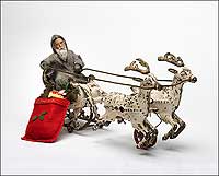 Santa
rides a cast-iron sleigh made in the United States