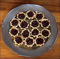 A plate of cranberry tarts