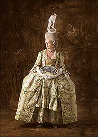 Orientation interpreter Cindy Gunther shows a cream-and-blue floral brocade gown with a gilt bobbin-lace-trimmed stomacher inspired by an antique in the collection of the Costume Institute in Kyoto, Japan.