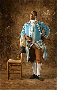 Journeyman silversmith Preston Jones in re-created livery from Virginia Governor Dunmore's household—robin's-egg-blue wool broadcloth waistcoat and coat trimmed in silver with brown wool broadcloth cuffs, collar, and breeches.