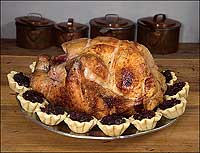 Food marks seasonal celebrations, and at Thanksgiving and Christmas, turkey, with cranberry tarts, usually runs neck and giblet with ham as the main dish.