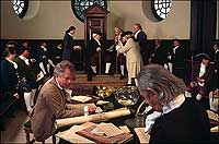 At the Capitol, above, Wayne Moss as Speaker Peyton Randolph and other Colonial Williamsburg interpreters as burgesses are abuzz over the cracking bonds between England and her American colonies.
