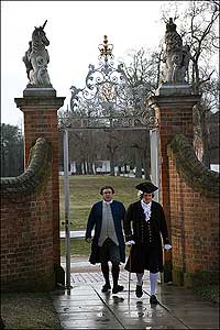 Colonial Williamsburg interpreters Bill Weldon, right, as patriot leader Peyton Randolph and Steve Holloway as Williamsburg's mayor pass the Governor's Palace gates to protest against removal of the gunpowder.