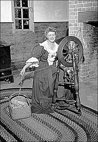 1947 photo of woman at spinning wheel