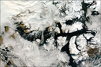 Seen in part in this satellite photo and winding its way from the Atlantic through archipelagoes of the Canadian Arctic and on to the Bering Strait between Alaska and Russia, the Northwest Passage remained unnavigable because of ice until recent thawing.