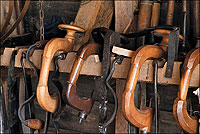 With curved drawknives to shape wooden staves and bitstocks to drill holes for pins, the cooper fashioned casks and barrels.