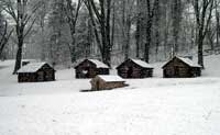 At Valley Forge, Continental soldiers weathered their worst winter of the American Revolution in earth-fast cabins such as these.