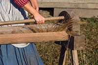 The first step in flax processing is to separate the straw from the fiber.