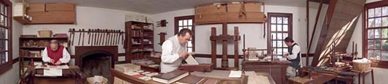In the bindery shop, are, left to right, Interpreter Addison “Brown” Evans, Master Bookbinder, Bruce Plumley, and Journeyman Bookbinder Dale Dippre. - Barbara Temple