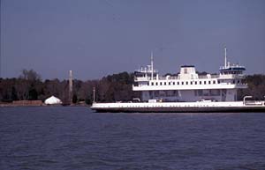 Modern remembrances of James I: the Jamestown Ferry slides down the James River past Jamestown Island bound for James City County. - Dave Doody