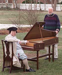 Redstone, right, and harpsichordist Michael Monaco, left, demonstrate the Barton’s portability in the backyard of the St. George Tucker House.