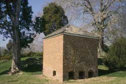 A graceful pyramid roof, and four removal bays, distinguish the outhouse at Maryland’s 1787 plantation His Lord’s Kindness.