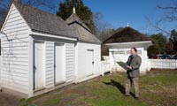 Colonial Williamsburg curator of architecture Willie Graham, next to the restored Grissell-Hay buildings, began his career with HABS.