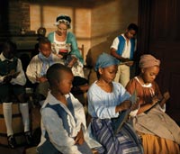Interpreter Antoinette Brennan recreates the headmistress Ann Wager, who ran a school for fourteen years for enslaved children.