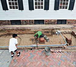 Archaeologists 
  re-exposed the square piers for the east end of the porch last summer, revealing there were several generations of open porches on the front of the Raleigh. 