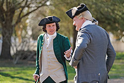 George Mason, portrayed by Joe Ziarko discusses the news of the day with Robert Carter III, portrayed by Gerry Underdown