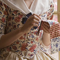 Woman stitching cloth