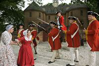 British troops distress gentle townsfolk, portrayed here by Kaitlin Kovach and Stacy Hasselbacher.