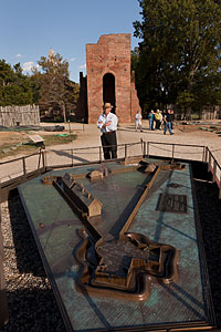 The author next to a 1/4-scale bronze model of the excavated
fort, with the tower of the 1647 church standing behind him