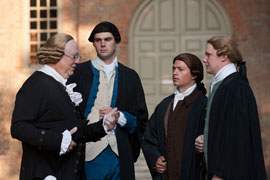 In the college yard, Professor Wythe meets students portrayed, from left, by Spencer Slough, Kris Jeager, and Jason Bailey.