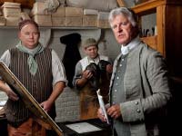 In the Print Shop, from left, Peter Stinely, journeyman printer, David Wilson, apprentice, and Dennis Watson as Alexander Purdie