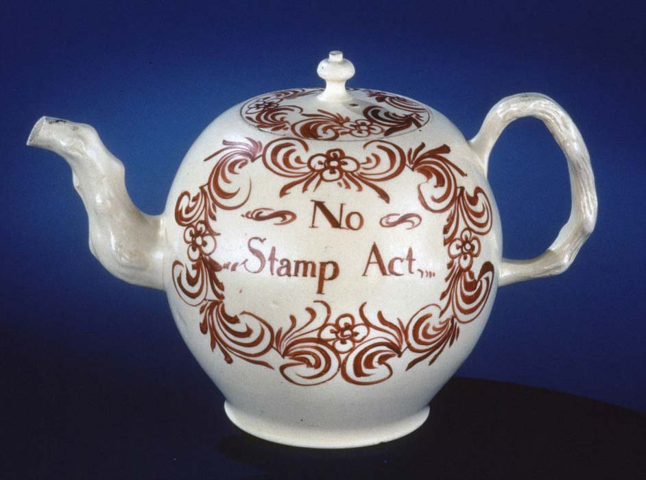 A creamware teapot commemorates the repeal of the 1765 Stamp Act, circa 1766.