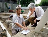 The author, right, reviews progress on excavation at the tin shop site, to be part of the reconstructed Anderson Armoury, with staff archaeologist Mark Kostro.