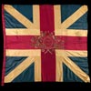 More than six feet wide, this "King's Colour," or flag, first flew during the French and Indian War when it was issued to the British Army's 96th Regiment of Foot under Colonel George Monson. Though Monson's regiment served only in India, its counterparts in North America carried flags of the same design made by the same contractors. Only the regimental numbers would have been different. Sewn from ribbed silk textiles and richly embroidered with silk and metallic threads, eighteenth-century military flags almost never survive except as fragments. This one is nearly pristine because its regiment was retired in 1765 after only four years service. Several officers who served under this banner fought against the colonists during the American Revolution. Their flag remained with Monson's descendants until Colonial Williamsburg acquired it.