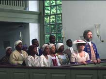 White couple with slaves at church